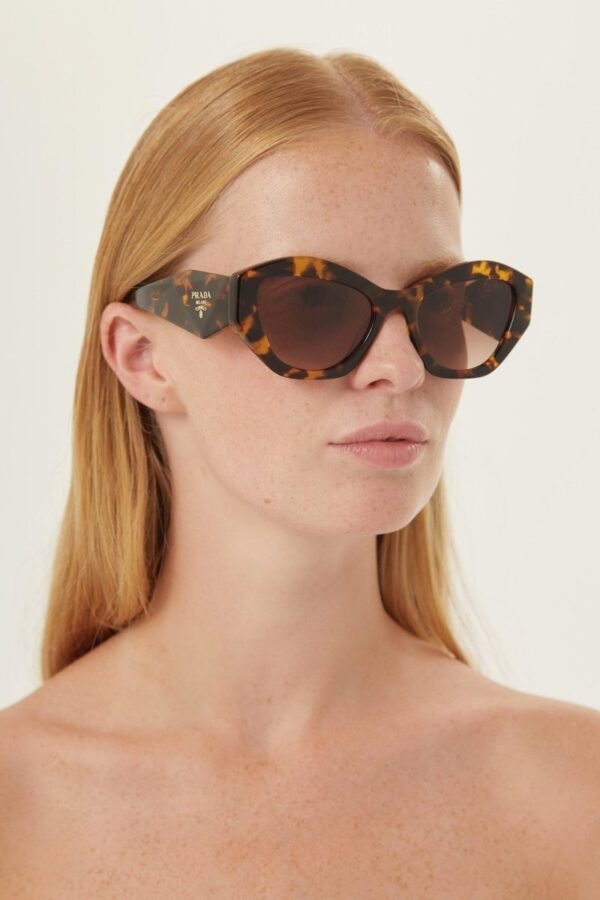 Prada oval sunglasses featuring iconic logo - Lux Studios