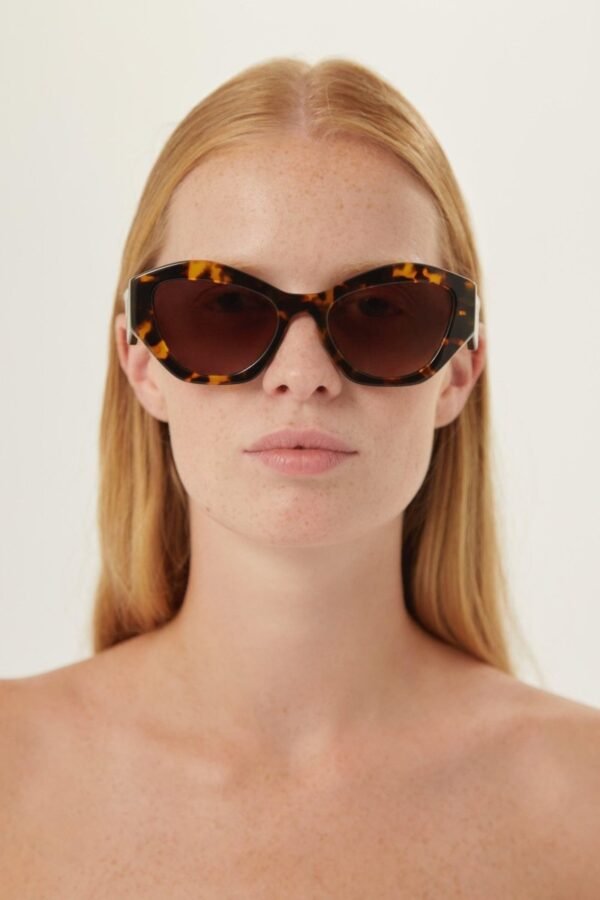 Prada oval sunglasses featuring iconic logo - Lux Studios
